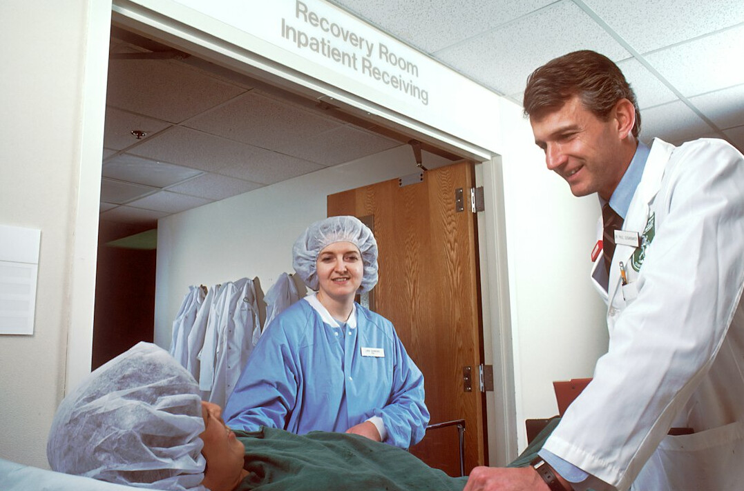 Doctor reviewing medical chart with patient