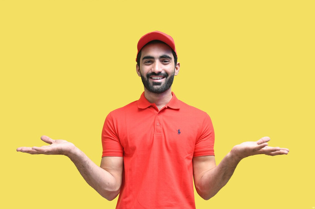 Portrait of a smiling male customer support lead