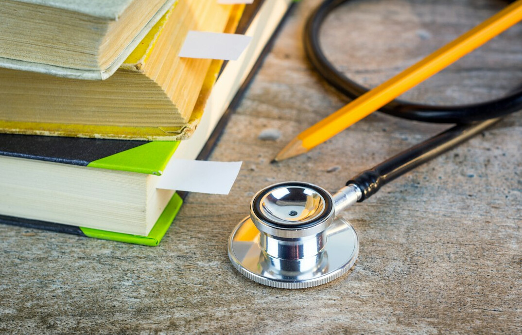 Stethoscope resting on medical documents