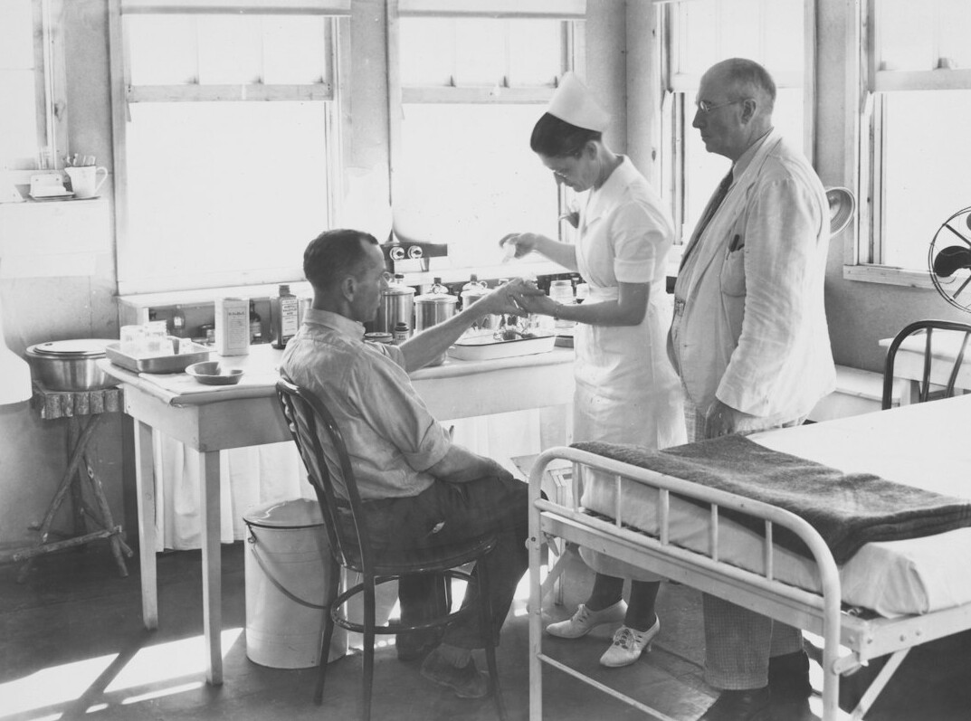 Doctor consulting with a senior couple in a bright clinic
