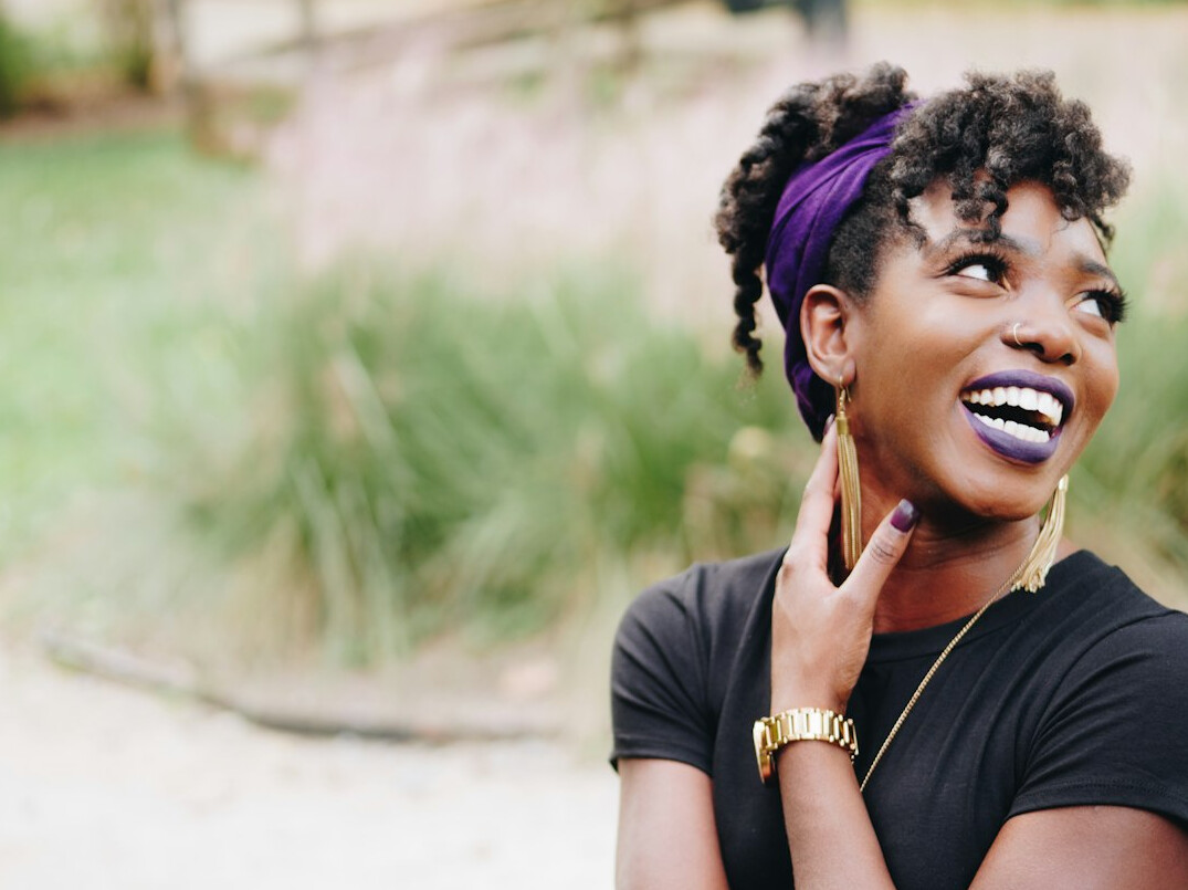 Customer support agent smiling with a headset